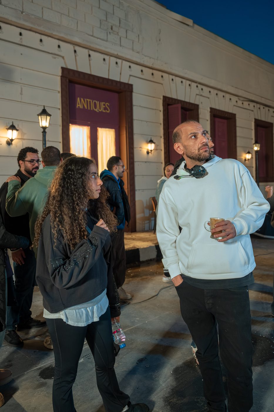 Director and crew reviewing playback on set